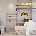 Shiba University Coffee Academy Storefront With Bar Counter Tables Stools And Green Plants