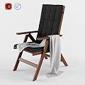 Modern Single Chair With Black Padded Backrest Seat Wooden Frame Armrests And White Blanket