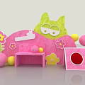 Interactive Area With Green Cat Shaped Decoration Pink Curved Background Flower Patterns And Colorful Balls