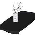 Black Rectangular Coffee Table with Floral Patterned Vase and Small Branches in Interior