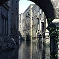Ancient European Architecture with Stone Walls Balconies Windows Stone Steps Surrounding Rocks and Trees