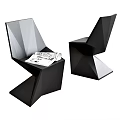Modern Geometric Accent Chairs in Black and Gray with Origami Design and Magazines on Seat