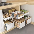 Modern Kitchen Cabinet Storage Rack With Multiple Drawers And Organized Glass Jars And Food Containers
