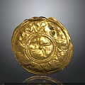 Golden Circular Carved Artifact With Intricate Floral Patterns And Decorative Design