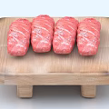 Four Pieces of Raw Rolled Meat on Wooden Cutting Board Ready to Cook