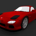 Red Toyota Sports Car With Streamlined Design Black Hood And Large Alloy Wheels