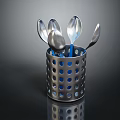 Stainless Steel Spoons In Perforated Metal Container With Blue Dots On Dark Background