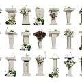 Elegant White Podiums With Various Floral Decorations And Greenery Accents