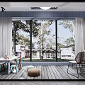 Modern Home Balcony With Large Glass Windows Wooden Flooring Kids Table And Chairs Green Plants