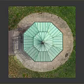 Outdoor Octagonal Gazebo With Green Roof And Surrounding Grass Stone Pavement