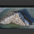 Scenic Natural Rock Arch Formation Over Calm Green Coastal Water