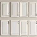 White Cabinet Doors Neatly Arranged In Two Rows With Four Each And Golden Handles
