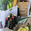 Assorted Fresh Foods And Beverages With Paper Bags