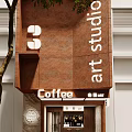 Modern Coffee Shop Facade Design With Wooden Elements And Warm Lighting