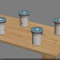 Four Compact White Household Appliances With Blue Lids On Wooden Table