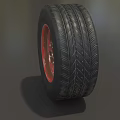 Car Tire With Black Tread Red Rim And Detailed Metal Texture Design