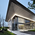 Modern Sales Center With Glass Curtain Wall Sloped Roof And Water Reflection