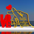 Red LOVE And Yellow Hand Sculpture Photo Spot With Pointing Red Heart And Inscribed Text