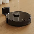 Smart Black Robotic Vacuum Cleaner With Charging Dock On Wooden Floor