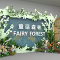 Fairy Forest Themed Stage With Green Plants Floral Decorations And Birdcage