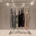 Modern Chrome Clothing Rack With Stylish Dresses And Shirts On