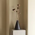 Black Cone Shaped Textured Vase With Dried Brown Flowers On Light Stand Against Beige Wall