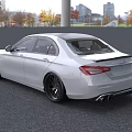 White Mercedes AMG Sedan With Sporty Front Grille And Black Alloy Wheels