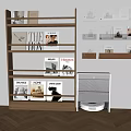 Wooden Bookshelf with Books Magazines and Framed Pictures and White Cabinet on Wooden Floor