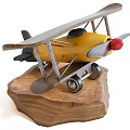Yellow Biplane Airplane Model With Silver Wings Red Propeller And Wheels On Wooden Base