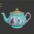 Blue Teapot With Pink Floral Patterns And Gold Accents On Lid And Handle