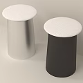 Two Modern Cylindrical Stools With Silver And Black Bodies And White Round Seats