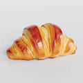 Freshly Baked Golden Brown Croissant With Flaky Layers And Buttery Taste