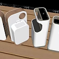White Electronic Devices With Various Shapes And Circular Openings On Wooden Surface