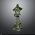 Traditional Stone Lantern With Moss Covered Top And Carved Base Structure