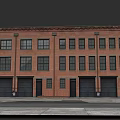 Red Brick Residential Building With Multiple Windows And Black Garage Doors