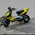 Yellow And Black Scooter Motorcycle Parked Roadside Near Stone Steps And Grass