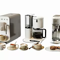 Various Modern Kitchen Appliances Including Coffee Makers With Cups And Cookies