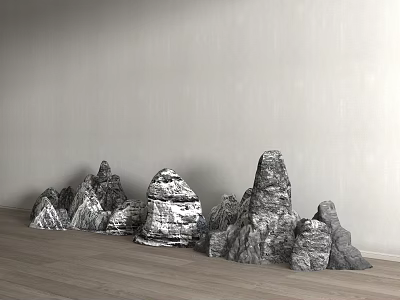Decorative Rockery Stones With Various Shapes Against Gray Wall On Wooden Floor 3d model