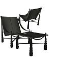 Modern Leisure Chair With Dark Upholstery And Ornate Metal Frame Legs