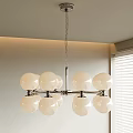 Modern Multi Globe Chandelier With White Spherical Shades And Metal Frame In Indoor Space