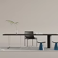 Modern Black Desk With Silver Legs Clear Vase Green Plant Laptop Black Chair Blue Stools