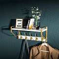 Modern Wall Mounted Coat Rack With Gold Hooks White Shelf Picture Frames And Flowers