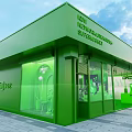 Green Lighting Accessories Showroom Exterior With Glass Windows And Display Items