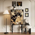 Elegant Black Decorative Cabinet With Golden Floral Bird Patterns And Floor Lamp Chair Wall Art