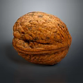Whole Natural Walnut With Brown Textured Shell On Dark Background