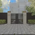 Black Metal Entrance Gate With White Pillars Slatted Fence Green Plants And Paved Courtyard