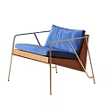 Modern Leisure Chair With Soft Blue Cushion Sleek Metal Frame And Natural Wooden Accent