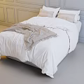Double Bed with White Bedding Gray Blanket and Light Pillows in Bedroom with Gray Walls