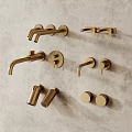 Gold Wall Mounted Faucets In Various Designs Showcased On Grey Wall