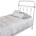 Single Bed with Black Iron Frame White Yellow Pillows Striped Sheets and Light Blanket